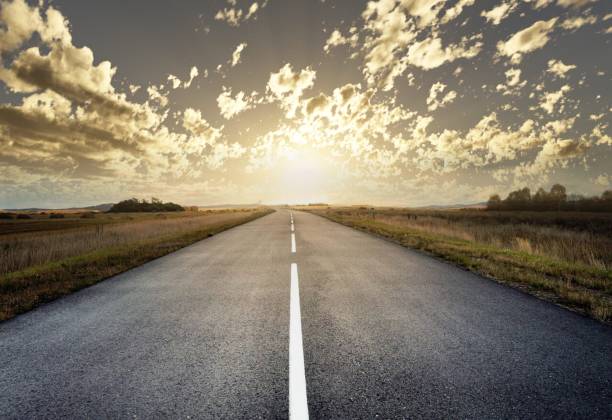 istock country road for background 988065848