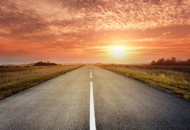 istock country road for background 988065854