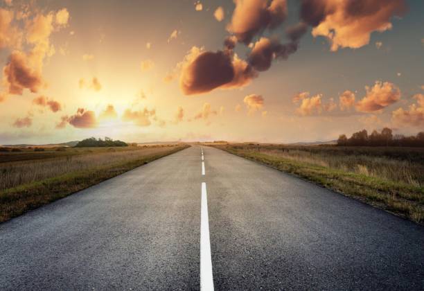 istock country road for background 988065858