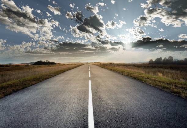 istock country road for background 988065866