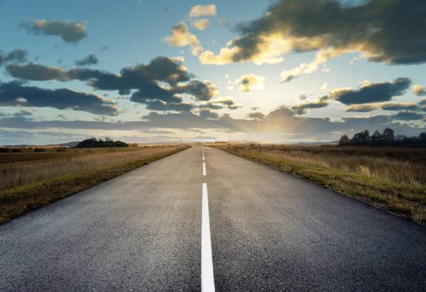 istock country road for background 988065870