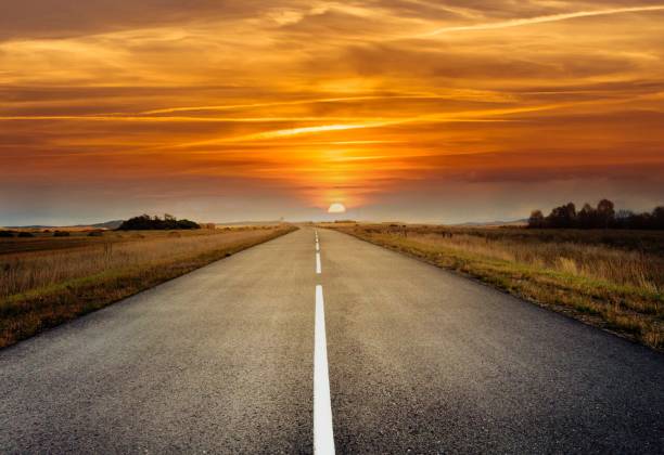 istock country road for background 988066040