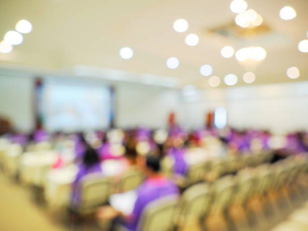 istock Blur of auditorium room use for conference present meeting background 988080582