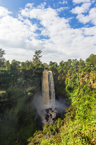 Landscape with a waterfall surrounded by jungle. Thompson Waterfall. Kenya, Africa