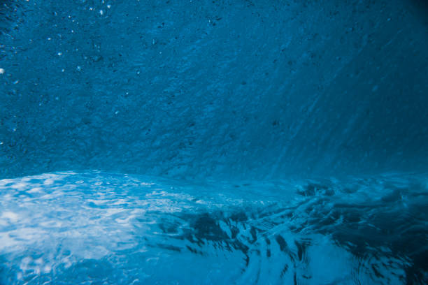 istock Underwater barrel wave in tropical ocean. Wave texture in sea 988095538