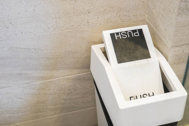 istock close up white bin to push trash in hotel restroom 988099456