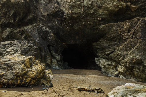 The Entrance to Merlin's Cave under Tintagel, Cornwall, England.