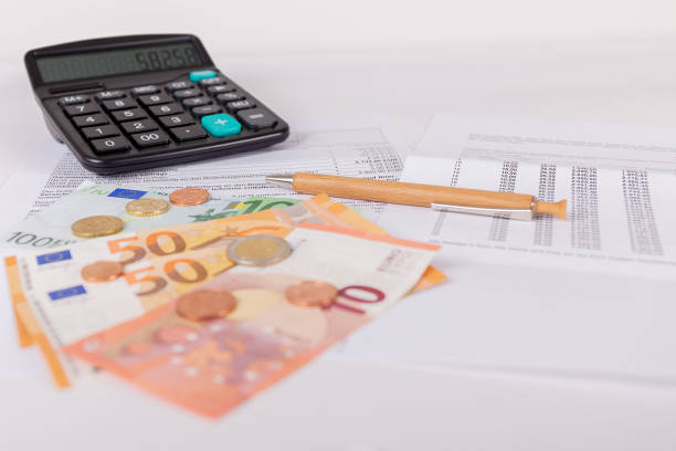 istock Check billing with a calculator and money on the table 988116346