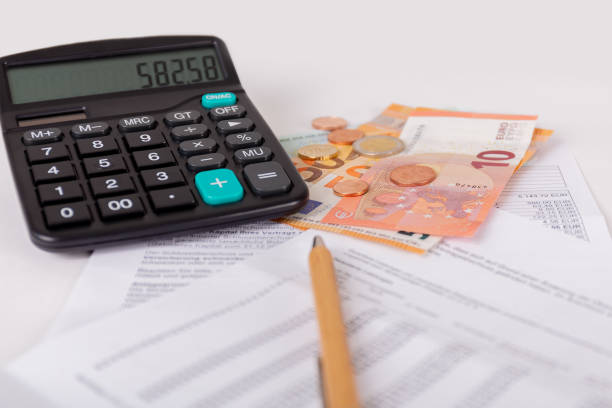 Check billing with a calculator and money on the table with white background