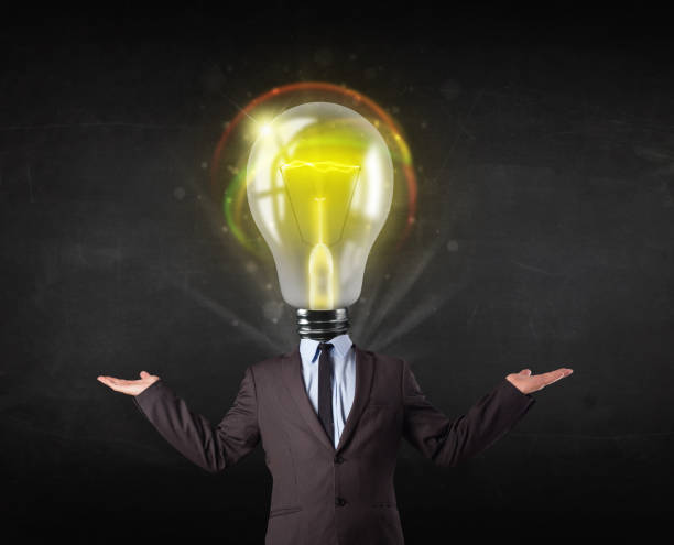 istock Business man with light bulb head concept 988125054