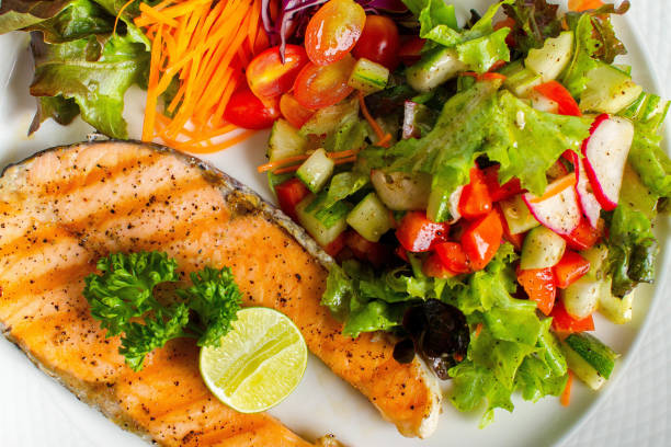 istock salmon steak grill with fresh salad 988139626