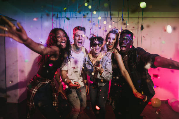 istock Friends enjoying at a house party 988139942