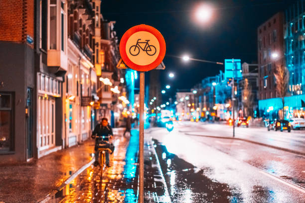 istock Bicycle lane sign on a night street 988144128