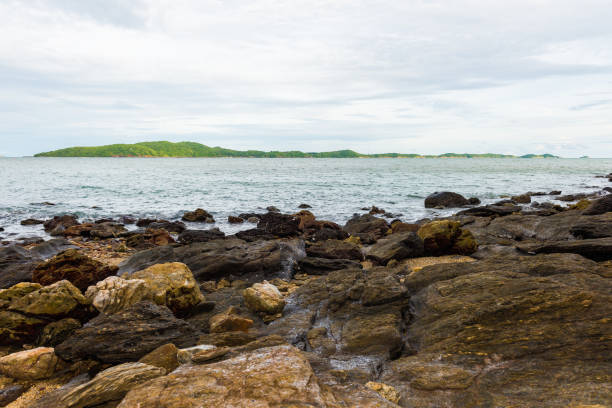Rocky coast at Khao Laem Ya Mu Ko Samet National Park Rayong, Thailand in sunset time