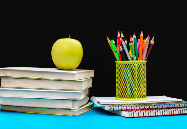 istock Educational equipment against blackboard. Back to school concept. 988152608