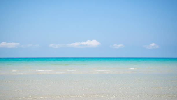 istock Idyllic seascape from tropical beach with clouds and clear water. 988152778