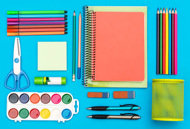 istock School supplies on blue. Top view. 988155668