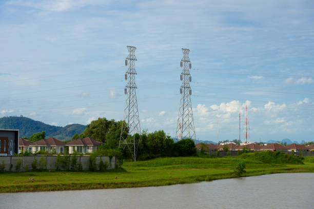 istock High voltage transmission towers, wide angle view. 988156046