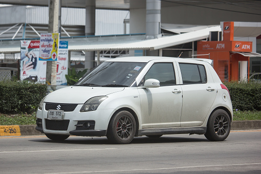 Chiangmai, Thailand - June 19, 2018: Private Eco city Car Suzuki Swift. Photo at road no.121 about 8 km from downtown Chiangmai, thailand.