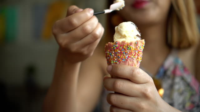 Young hipster woman eating ice cream