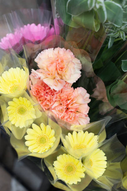 istock Carnations and gerberas on sale 988173814