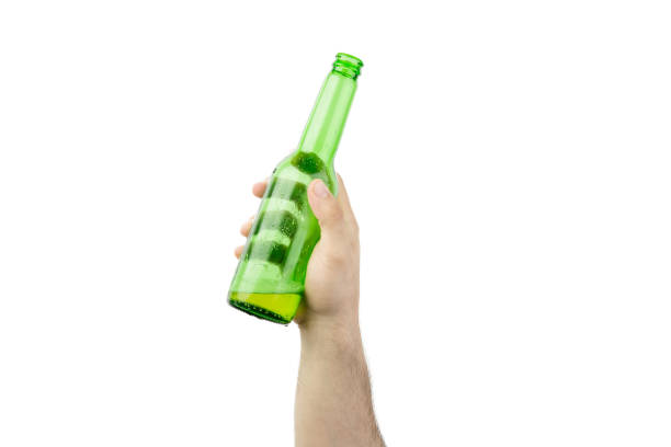 istock Hand Holding Ice Cold Wet Green Beer Bottle Isolated On White  Background 988174032