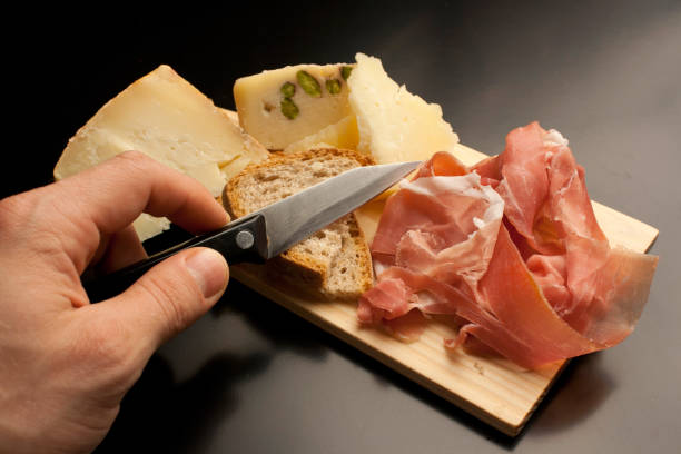 istock Tagliere with ham, bread and pecorino cheese 988174574