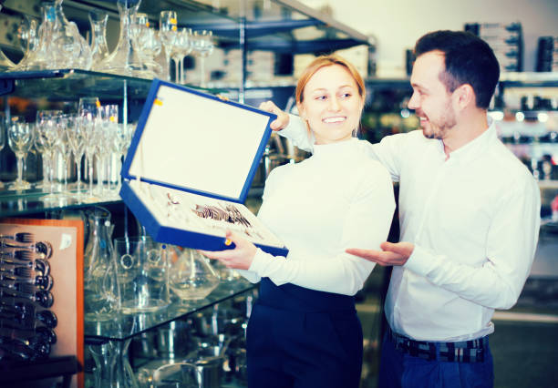 istock Couple choosing cutlery in store 988187754