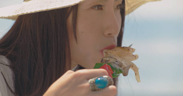 istock Young people eating outdoors. 988191804