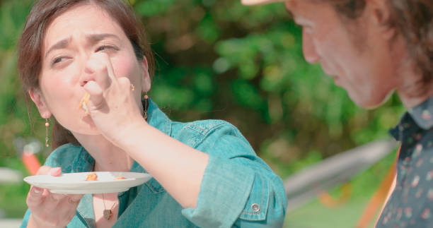 istock Young people eating outdoors. 988191910