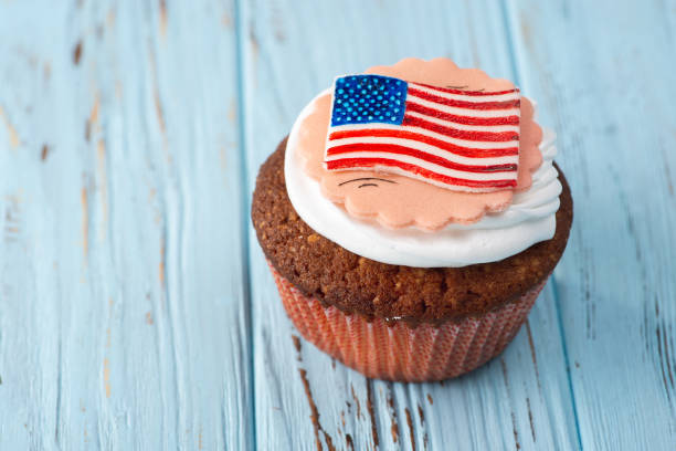 istock Beautiful American Capcake on a Blue Table 988193468