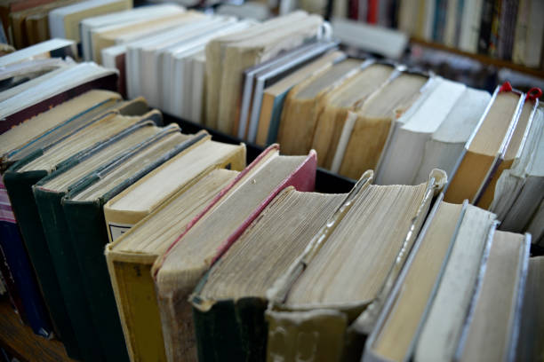 istock Old books in the library shelves 988196432