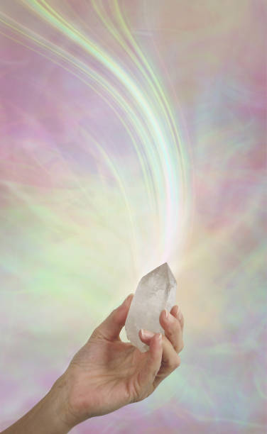istock Holding a Quartz Wand emitting energy 988196478