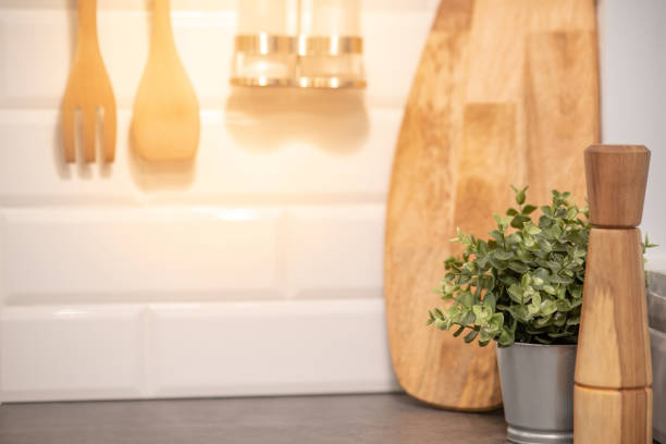 istock Wooden kitchenware in the kitchen. Handmade cooking utensils for kitchen interior and decoration background 988197318