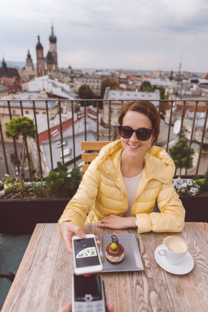 istock Woman in Krakow old town using digital wallet for mobile payment 988201936