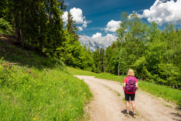 istock Senior female hiking in the Austrian Alps 988207984