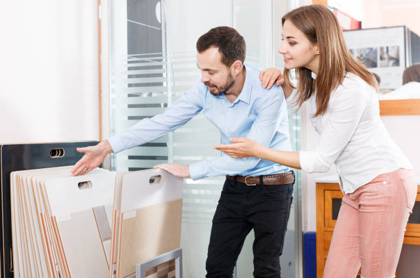 istock Couple choosing ceramic tiles in shop 988214316