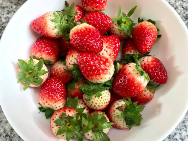 istock Pile of fresh strawberry fruit 988219842