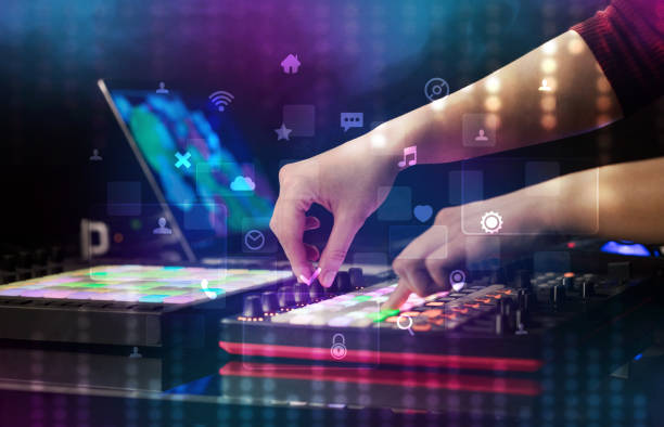 istock Hand mixing music on midi controller with social media concept 988227444