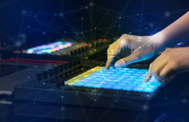 istock Hand mixing music on midi controller with play music and multimedia concept 988227512