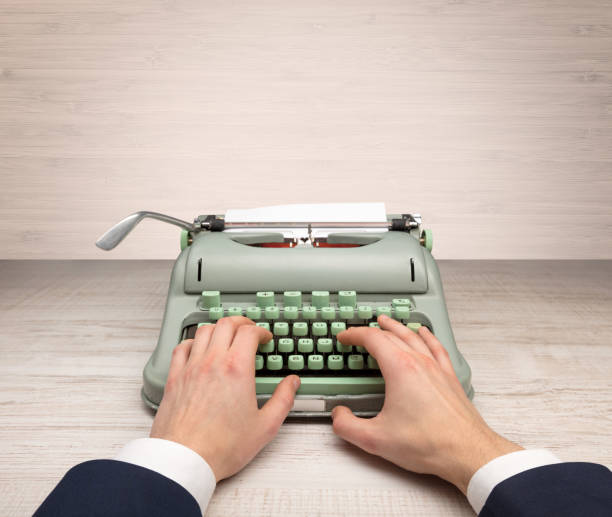 istock First person perspectve hand writing on an oldschool typewriter 988227564