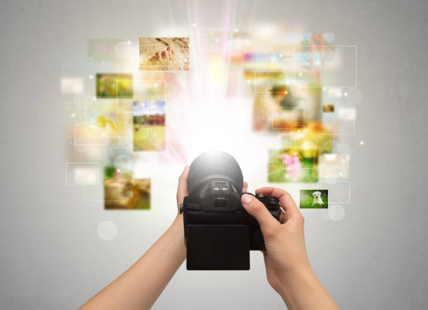 istock Hand captures life events with digital camera 988227782