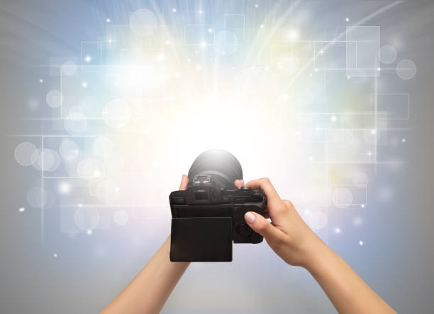 istock Hand taking photo with glowing flash concept 988228056