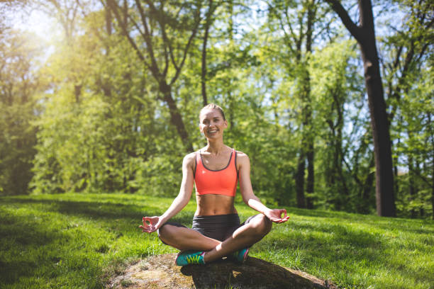 istock Happy woman is laughing during yoga practice 988229708
