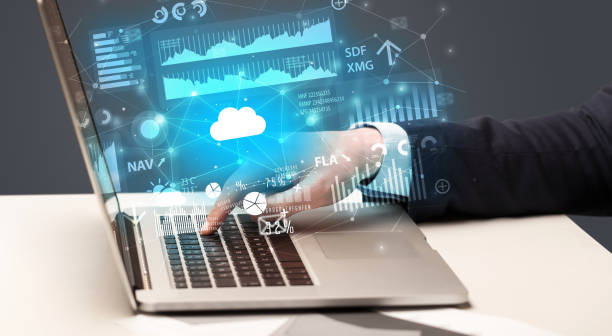 istock Hand typing on laptop graphs and charts and reports concept around 988229728