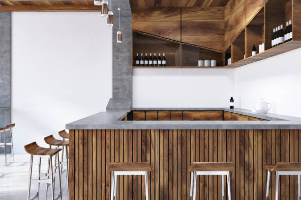 istock Wooden bar interior, stools and bottles close up 988229856