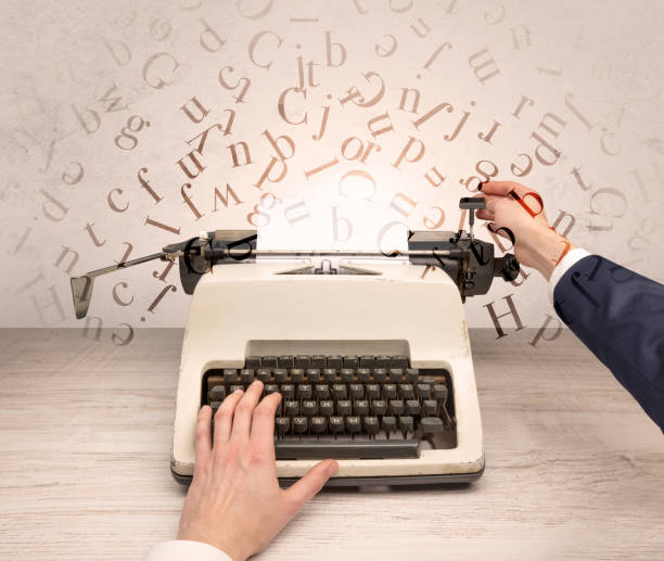 istock First person perspective elegant hand typing with flying letters concept 988233746