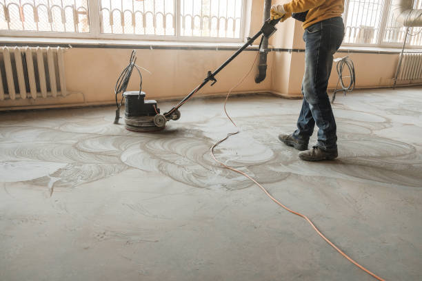 grinding of concrete floor workers grind the concrete floor at the construction site grind stock pictures, royalty-free photos & images