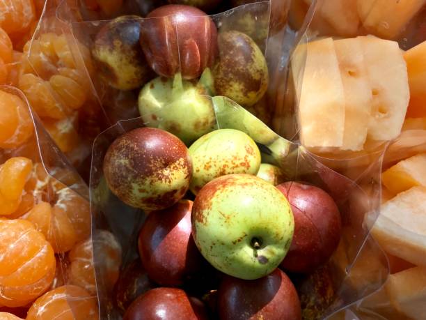 istock Fresh jujube in plastic bag selling in fruit shop 988238454