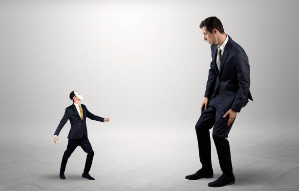 istock Conflict between small and big businessman 988238684